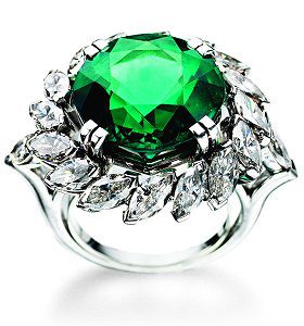 A green ring with white stones on it
