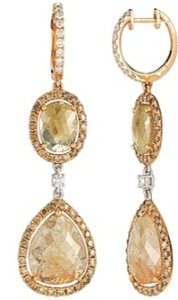 A pair of yellow gold earrings with diamonds.